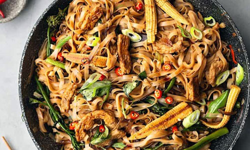 Pad Kee Mao noodles on a flat plate