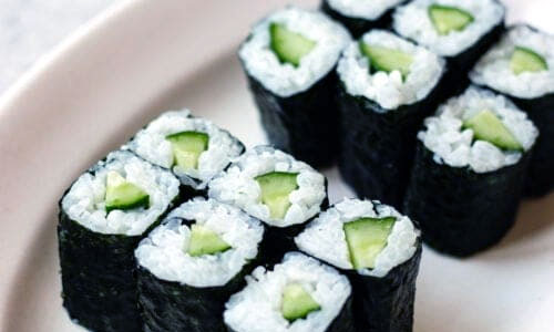 Kappa Maki sushi rolls on a wooden board